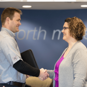 Per Mar technician shaking hands with customer