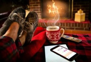 Hot beverage in front of fireplace