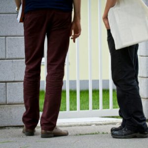 2 people outside front door
