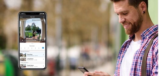 Looking at door bell on phone