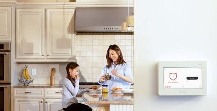 mom and daughter in kitchen with keypad