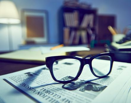 pair of glasses on a paper