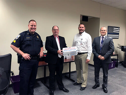 Pete Stussy from our La Crosse branch presenting food to the Onalaska Police Department to show our appreciation for all they do