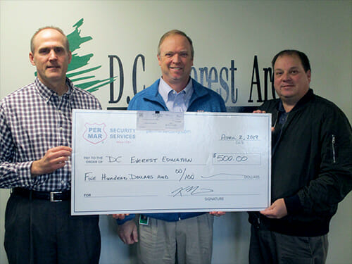 Ken Nerison and Mark Beda from our Wausau branch presenting a check to a contact at DC Everest Education Foundation.